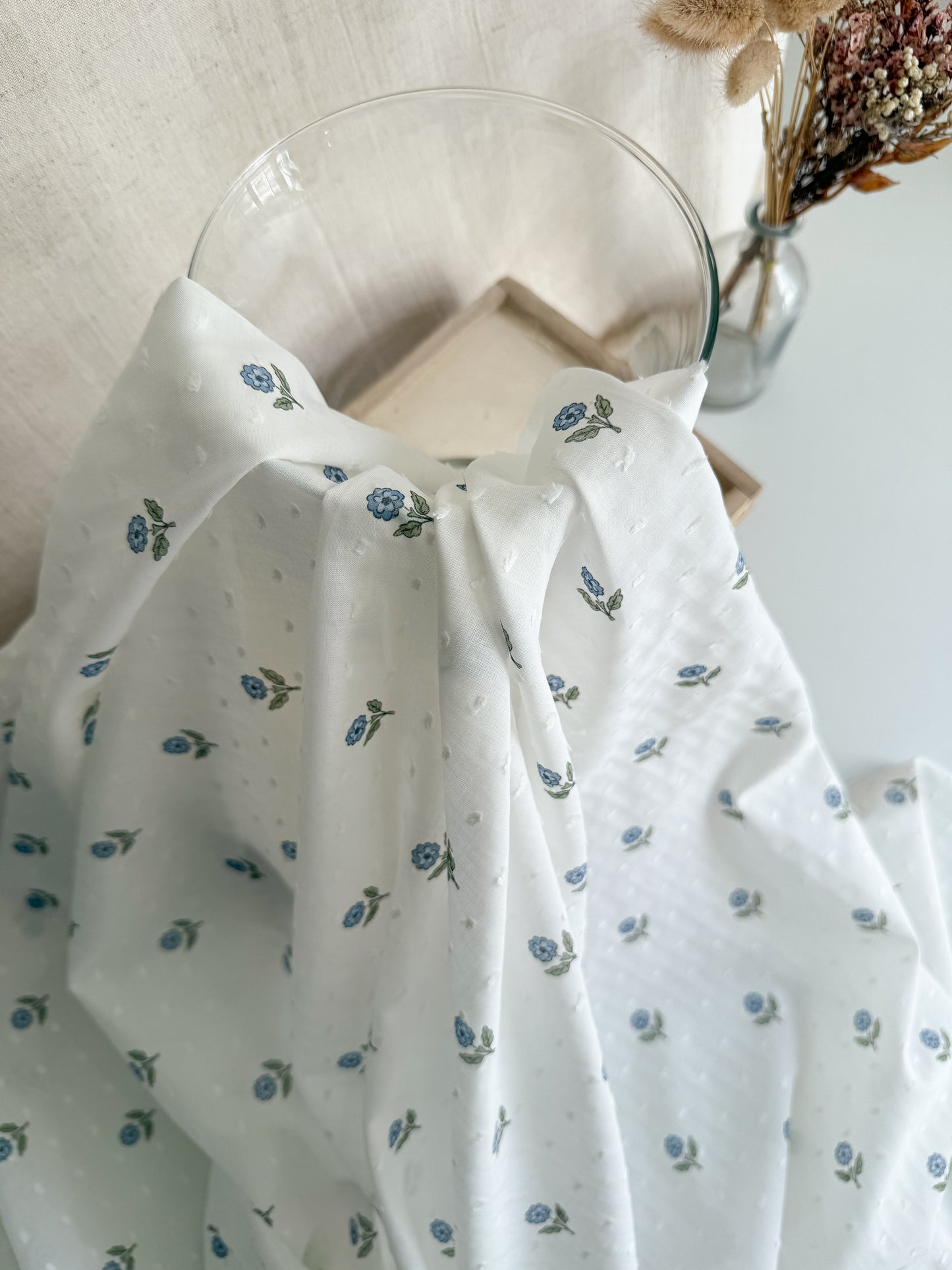 White and blue swiss dot floral cotton dressmaking fabric