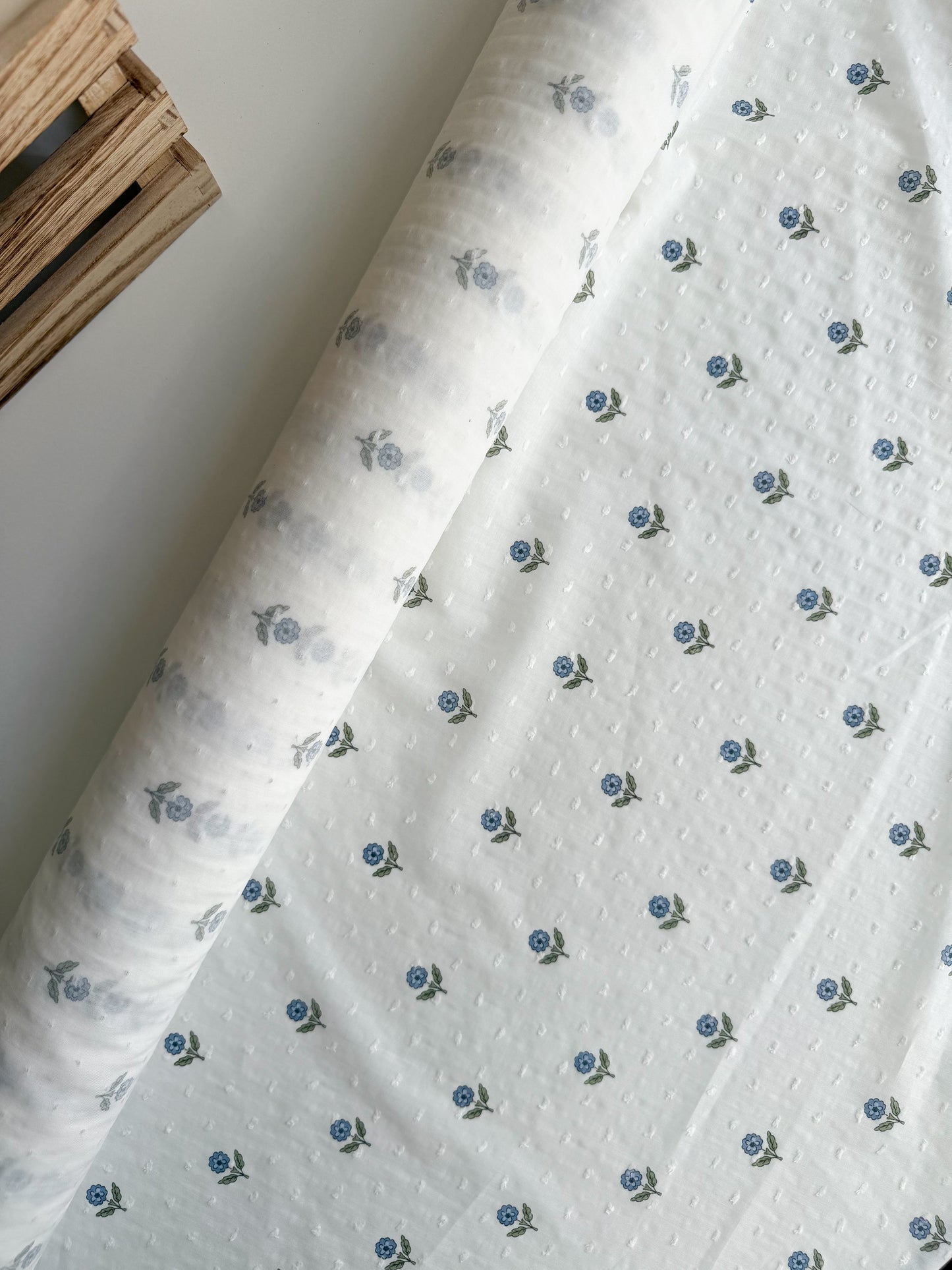 floral fabric on white swiss dot cotton fabric