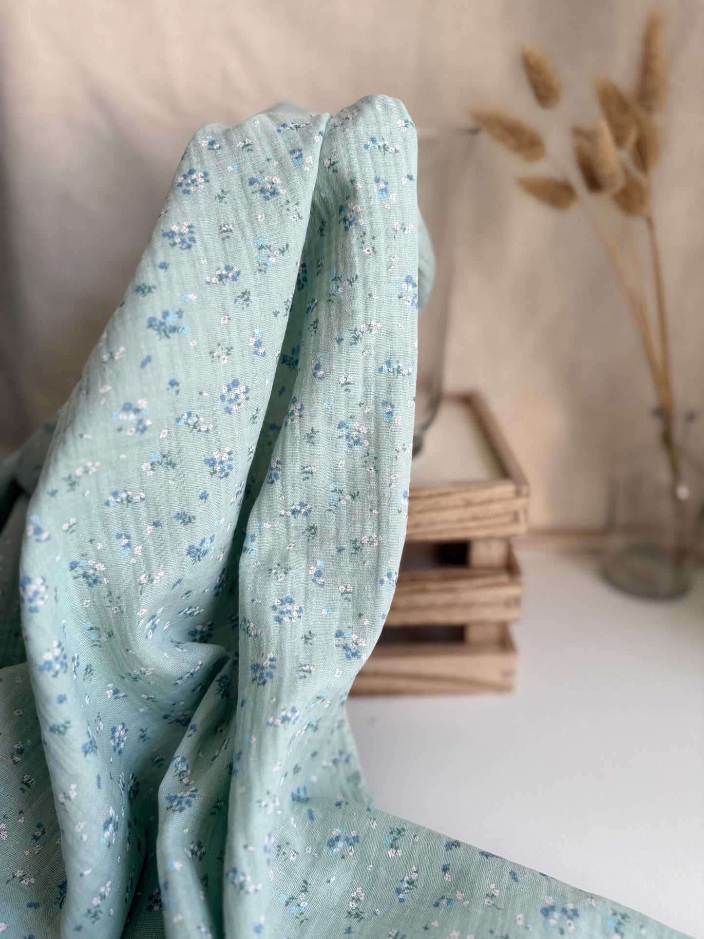 GOTS organic cotton double gauze muslin fabric in mint green and blue and white floral print