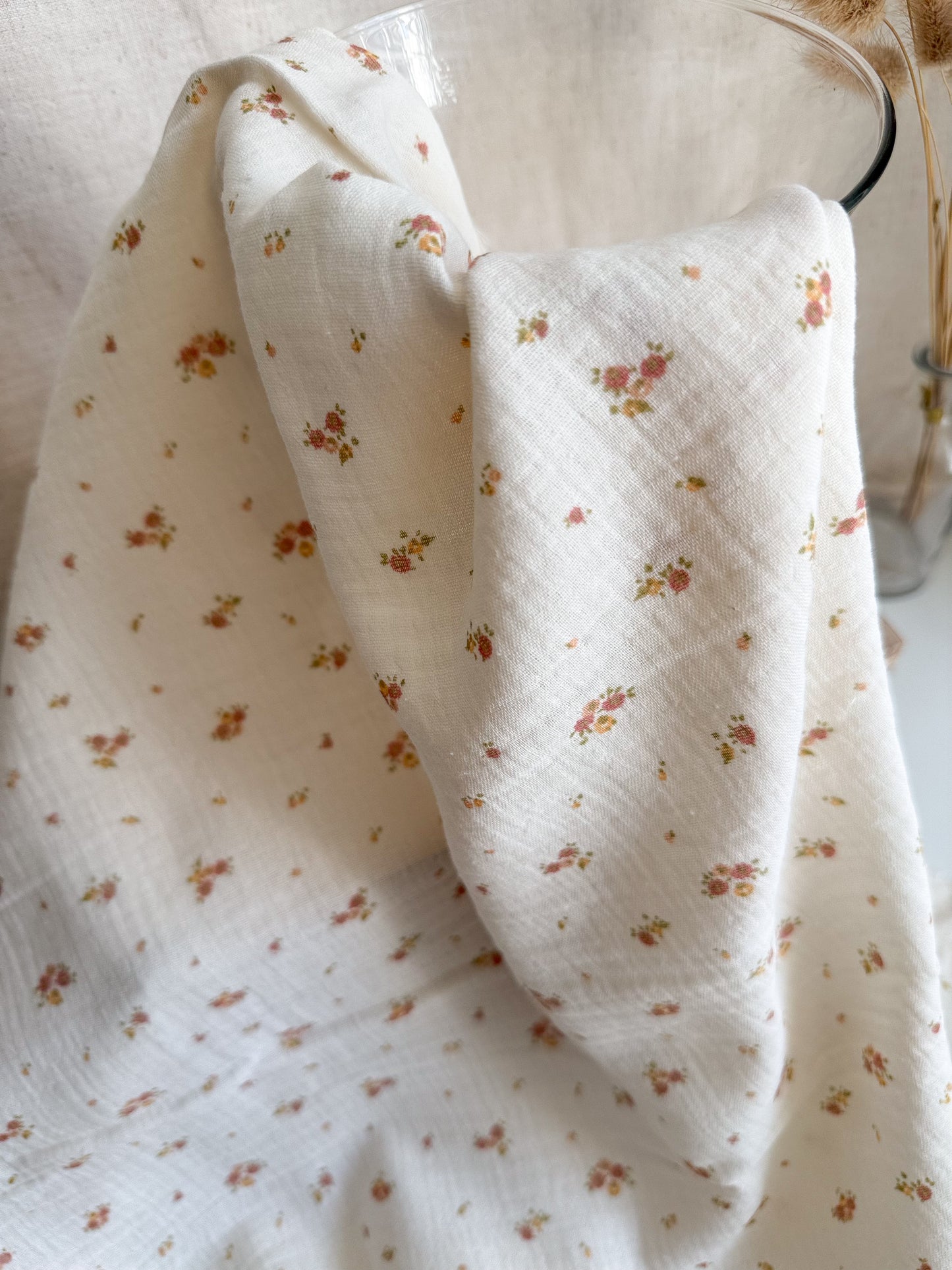 Tiny Flowers printed on organic cotton double gauze fabric in neutral yellow, pink and peach colours