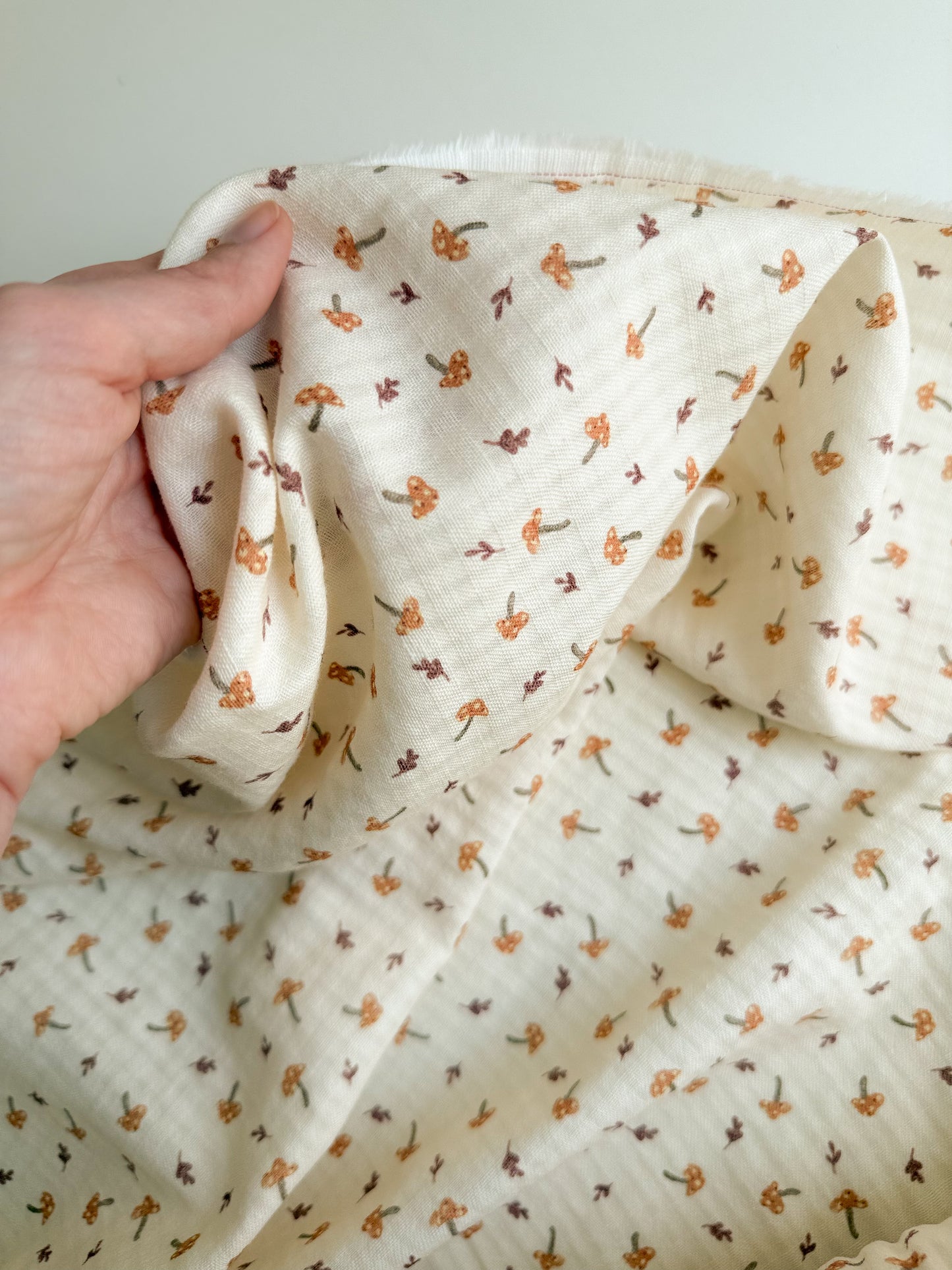 Organic cotton seersucker sewing fabric with mushroom print