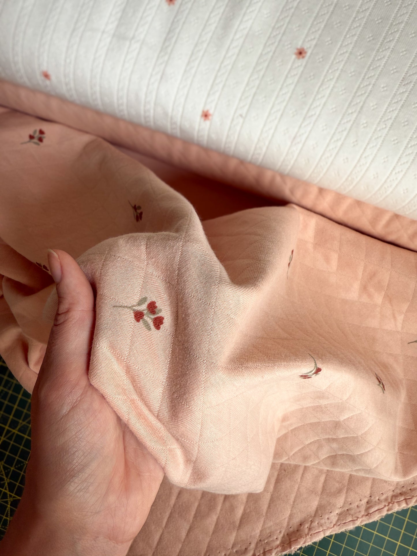 Close up of floral print on quilted jersey fabric