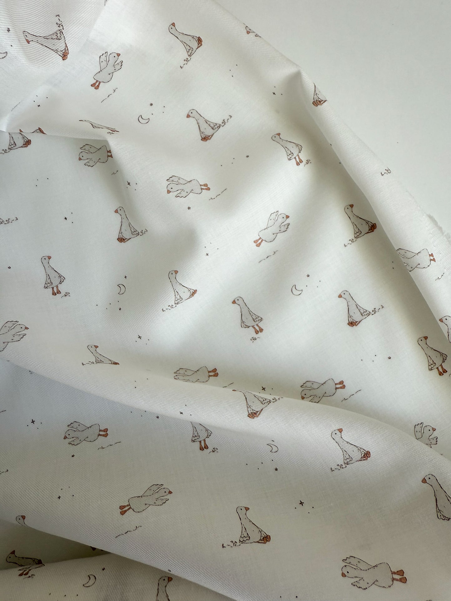 Fabric with duck pattern on a white background