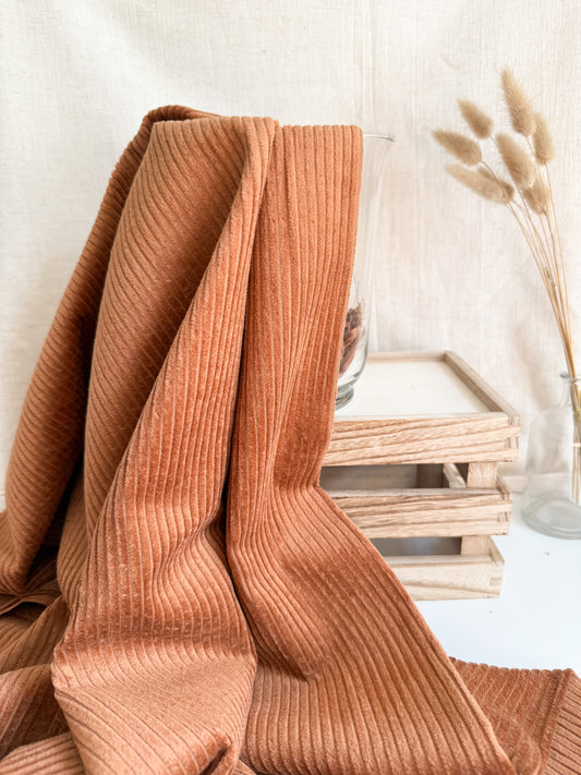 Textured cotton corduroy fabric in a warm gingerbread colour