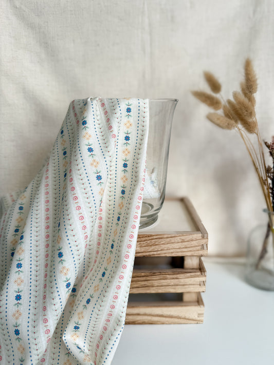 Floral patterned cotton fabric with a neutral background