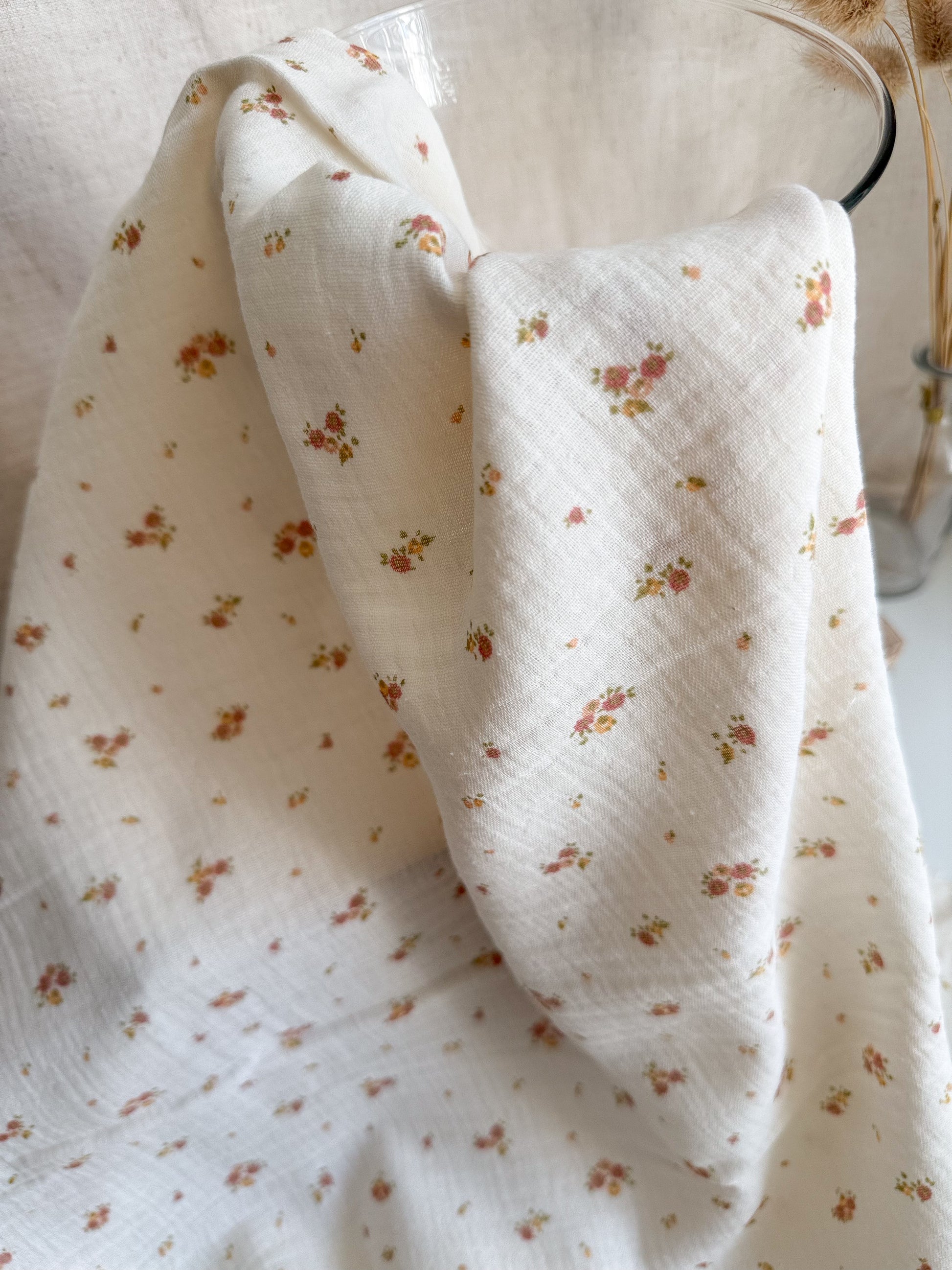Tiny Flowers printed on organic cotton double gauze fabric in neutral yellow, pink and peach colours