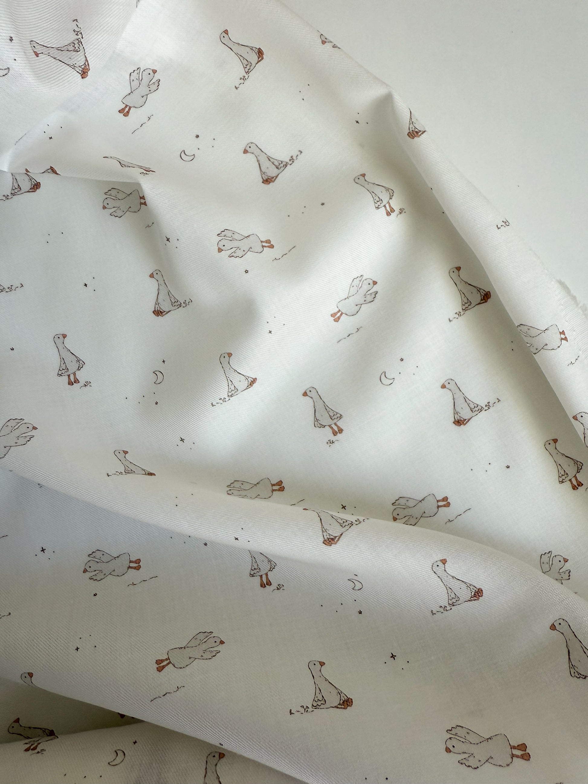 Fabric with duck pattern on a white background