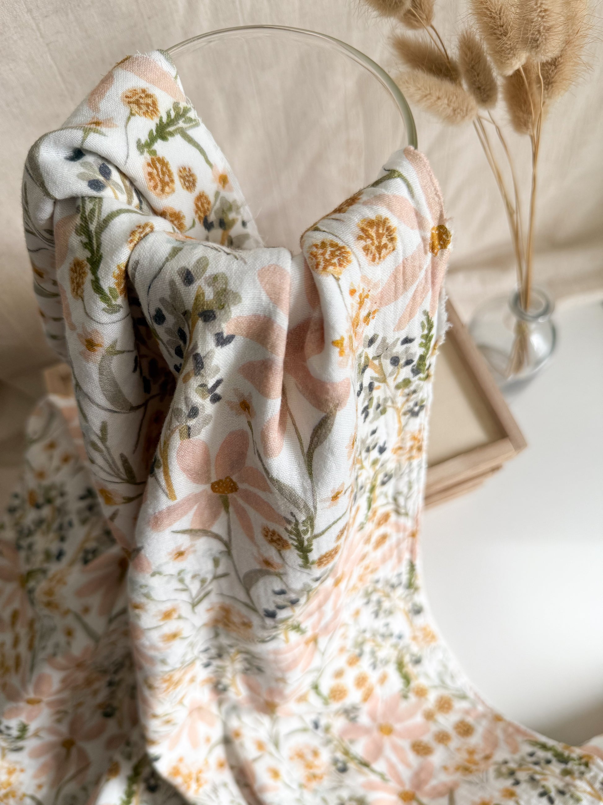 A floral double gauze lightweight fabric with pretty soft pastel flowers